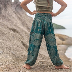 turquoise kids pants with two pockets image 5