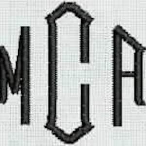 May include: Black embroidered monogram with the letters "MCA" in a gothic font style.