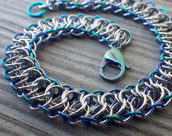 Stainless steel chain maille bracelet with anodized niobium edging in blues and purples