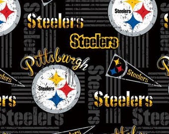 May include: A black fabric pattern featuring the Pittsburgh Steelers logo, which consists of three stars in yellow, red, and blue inside a white circle. The design includes the text Steelers and Pittsburgh in yellow and black, along with pennant graphics.