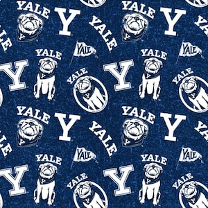 May include: A navy blue fabric with a repeating pattern of white Yale Bulldogs, the letter "Y", and the word "YALE". The bulldog is wearing a bandana. The design includes a small flag with the word "YALE".