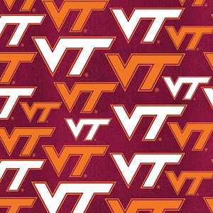 May include: A maroon fabric featuring a repeating pattern of the VT logo in alternating white and orange colors. Each logo includes a small registered trademark symbol. The design is oriented in various directions across the surface.