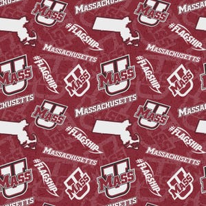 May include: A maroon fabric pattern featuring the white UMass logo, the word Massachusetts, the hashtag #FLAGSHIP, and a white silhouette map of the state of Massachusetts. The design is repeated across the entire surface in a consistent layout.