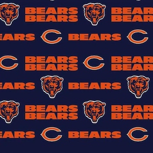 May include: A dark navy blue fabric featuring a repeating pattern of the orange Chicago Bears bear head logo, the orange letter C logo, and the word BEARS printed in bold orange capital letters throughout the entire surface of the material.