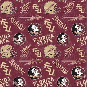 May include: A maroon fabric featuring a repeating pattern of Florida State University logos, including gold football helmets, spears, the FSU monogram, the Seminoles text, and the profile of a person with face paint and a feather in their hair.