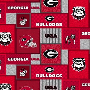 May include: A fabric pattern featuring the University of Georgia Bulldogs logo, the text Georgia, UGA, and Bulldogs, a football helmet, and a bulldog mascot. The design uses a repeating collage of red, white, and grey blocks with various textures.