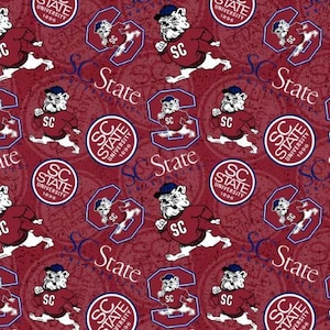 May include: A maroon fabric pattern featuring the South Carolina State University bulldog mascot running in a maroon sweater with SC lettering, alongside circular SC State University 1896 logos and the text SC State in a repeating graphic design.