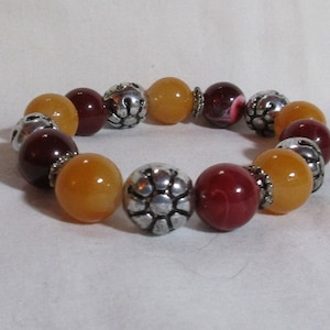 Silver Tone, Orange, and Cherry Red Round Beads with Spacers - Stretchy Bracelet