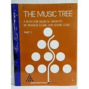 May include: The Music Tree: A Plan for Musical Growth by Frances Clark and Louise Goss, Part C, a book cover with a brown background and a white tree with circles for leaves.