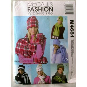 May include: A McCall's Fashion Accessories pattern envelope featuring various hat, scarf, and glove designs. The designs include plaid, polka dot, and striped patterns. The text "FABULOUS FLEECE" is visible.