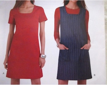 May include: Two dresses are displayed. On the left is a red, short-sleeved dress with a square neckline. On the right is a blue and white striped pinafore dress with a square neckline and pockets, worn over a long-sleeved red top.