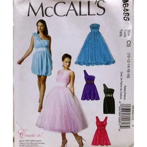 Puede incluir: Patrón de costura McCall's M6466 para vestidos de mujer. El patrón presenta varios diseños de vestidos, incluyendo un vestido de un solo hombro, un vestido sin tirantes y un vestido con falda amplia. El patrón incluye tallas 10-18.
