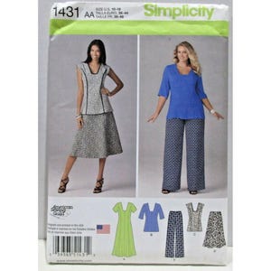 May include: Simplicity sewing pattern 1431 for sizes 36-44. The envelope displays two outfits: a sleeveless patterned top with a matching skirt, and a blue short-sleeved top with patterned wide-leg trousers. Includes illustrations of garment pieces.