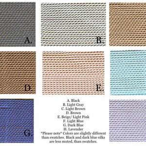 May include: Color swatches of different shades of silk fabric, including black, light gray, light brown, brown, beige, light pink, light blue, dark blue, and lavender. The swatches are arranged in a grid with letters A through H labeling each swatch.