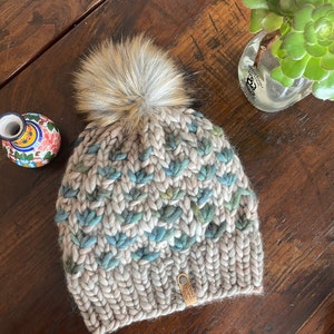 Hand knit Adult Beanie Hat with Faux Fur Pom Pom. 100% Merino Wool. Teal Lotus Flower/Whole grain.  Super Soft Winter Hat. Malabrigo Rasta