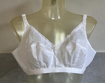 May include: White lace bra with adjustable straps and a hook and eye closure in the back.