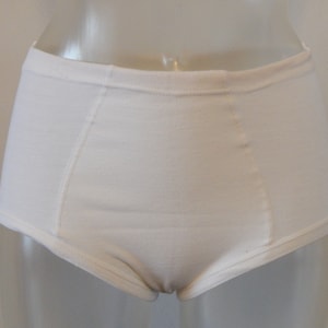 May include: White cotton underwear with a high waist and a wide leg opening.