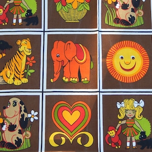 May include: A brown fabric with a repeating pattern of colorful animals, hearts, and a sun. The animals include a tiger, elephant, monkey, and dog. The hearts are red, yellow, and green. The sun is yellow with a smiling face.