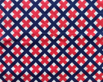 May include: Red and white checkered pattern on a blue background. The pattern is made up of small squares arranged in a diagonal grid.