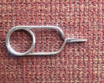 Key to adjust screw to loosen or tighten tension of bobbin