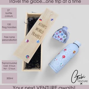 May include: A light blue thermal insulated water bottle with flag decals, a wooden box with the text "KERRI'S WORLD TRAVELS", and a small bag of flag transfers. The bottle keeps liquids cold for 8 hours and hot for 12 hours.