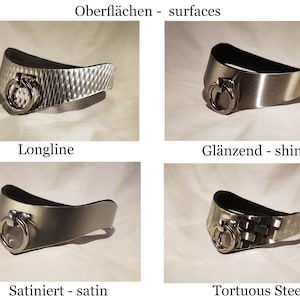 May include: Four silver metal collars with different finishes: longline, shiny, satin, and tortuous steel. Each collar has a silver ring with a black leather backing.
