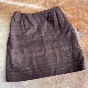 Very Rare Moschino Fashion History &#39;Anni Di Kaos&#39; Iconic Print Brown Wool Skirt 1997 Cheap And Chic by Moschino