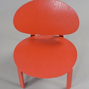 May include: A white ceramic mug with a black handle and the text "But First, Coffee" in a black, bold font. The mug is on a white surface.