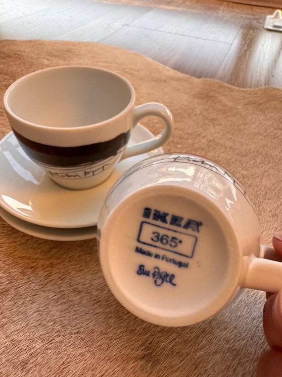 Vintage IKEA 365+ espresso cups and saucers designed by Susan Pryke, featuring a distinctive hand-painted black scribble design