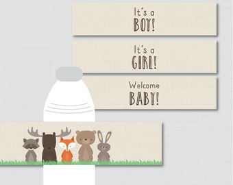 May include: Printable water bottle labels with a woodland theme. The labels feature a raccoon, moose, fox, bear, and bunny. The text on the labels reads "It's a Boy!" "It's a Girl!" and "Welcome Baby!"