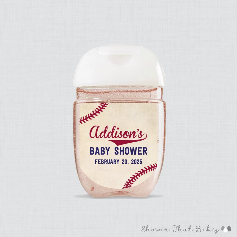 May include: A clear, baseball-themed hand sanitizer bottle with a white cap. The label reads "Addison's BABY SHOWER FEBRUARY 20, 2025" in burgundy script and block letters, with baseball stitching accents.