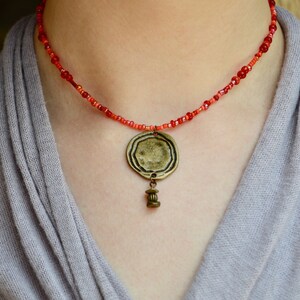 Red Seed Bead Choker: Sedona Sunset Antique Brass Pendant