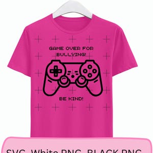 May include: Pink t-shirt with a black video game controller graphic and the text "Game Over For Bullying! Be Kind!"