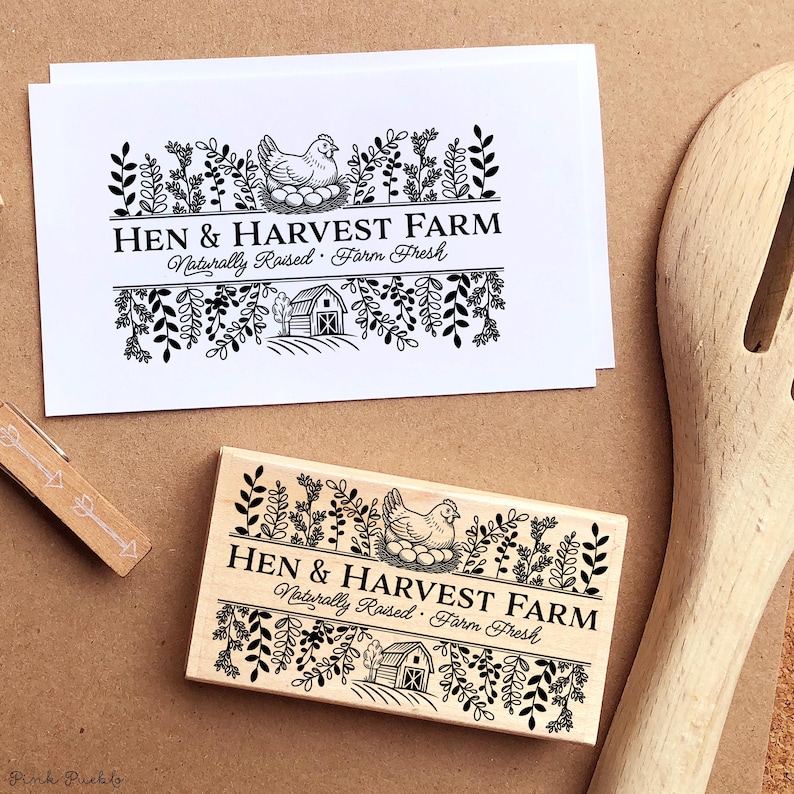 Custom rubber stamp impression reading "Hen & Harvest Farm – Naturally Raised · Farm Fresh" stamped in black ink on the inside lid of a green egg carton, shown with a dozen fresh brown eggs. Perfect for backyard chicken keepers, small farms, and handmade packaging.