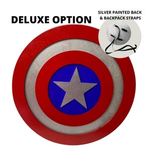 May include: Deluxe option Captain America shield with a red, white, and blue design. The back of the shield is painted silver and has straps for wearing as a backpack.