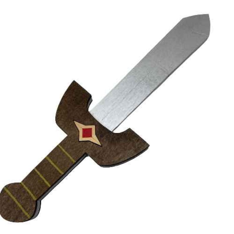 May include: A wooden toy sword with a brown handle and a silver blade. The sword has a red and gold diamond-shaped design on the handle.