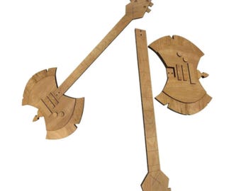 May include: Wooden guitar-shaped wall art pieces. The art pieces are light brown and feature a guitar headstock, neck, and axe-shaped body. The design includes cut-out details and a natural wood grain finish. The pieces are arranged against a white background.
