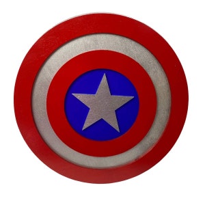 May include: A red, white, and blue Captain America shield with a silver star in the center.