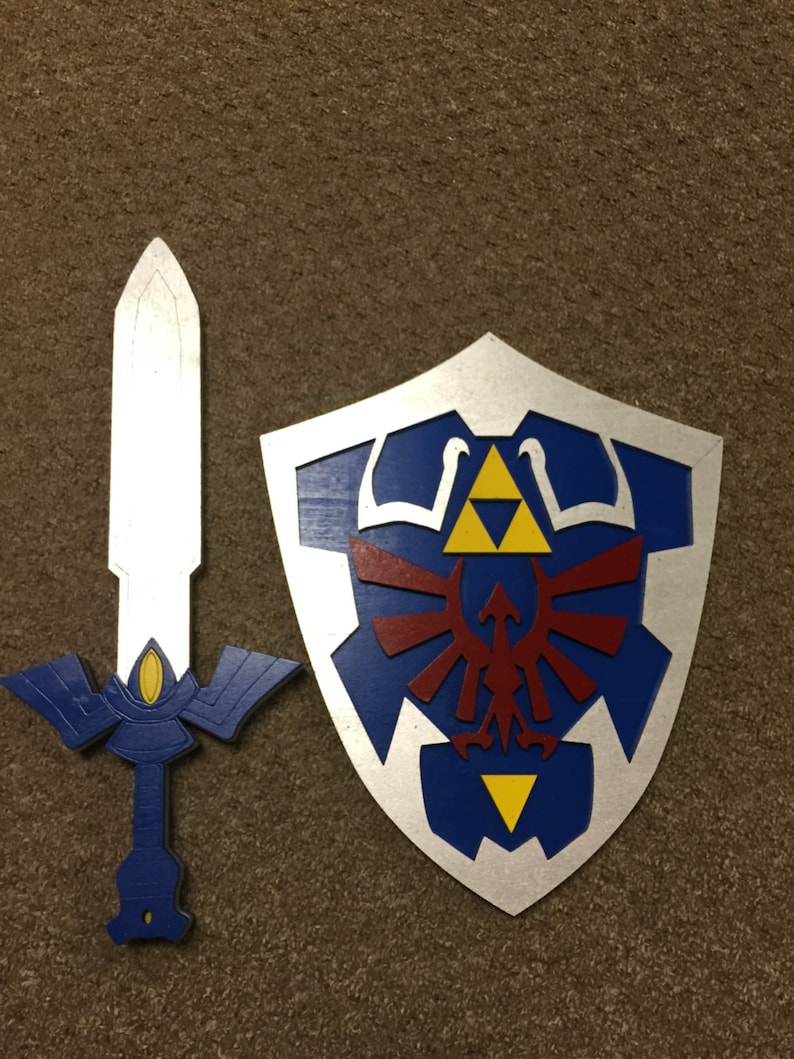 May include: A blue and silver shield with a red and yellow Triforce symbol and a blue and silver sword with a gold handle.
