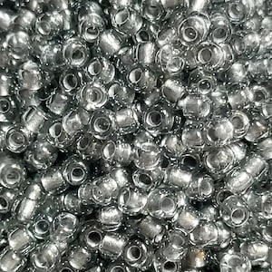 Miyuki 11/0 seed beads.  Transparent grey with silver lining. 10gm.