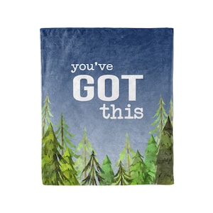 May include: A blue fleece blanket with a watercolor illustration of a forest and the text "you've GOT this" in white.