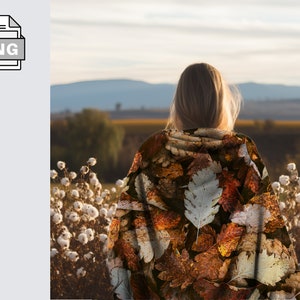 May include: A person wearing a brown and beige hooded sweatshirt with a leaf pattern. The person is standing in a field of white cotton plants and looking out at a distant landscape.