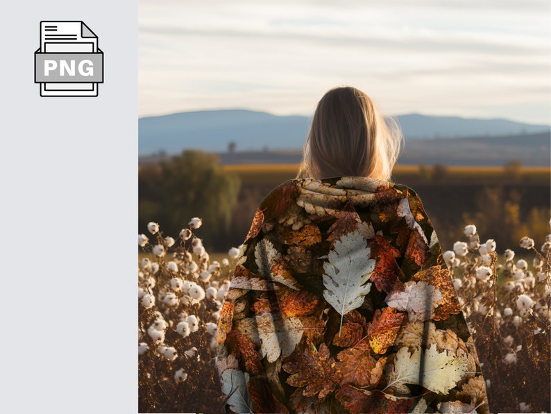 May include: A person wearing a brown and beige hooded sweatshirt with a leaf pattern. The person is standing in a field of white cotton plants and looking out at a distant landscape.