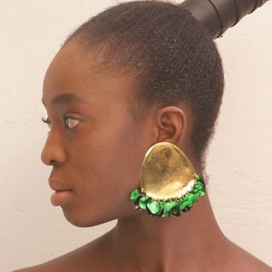 Statement earrings in gold and green emerald colors. Chunky stud earrings  for Xmas