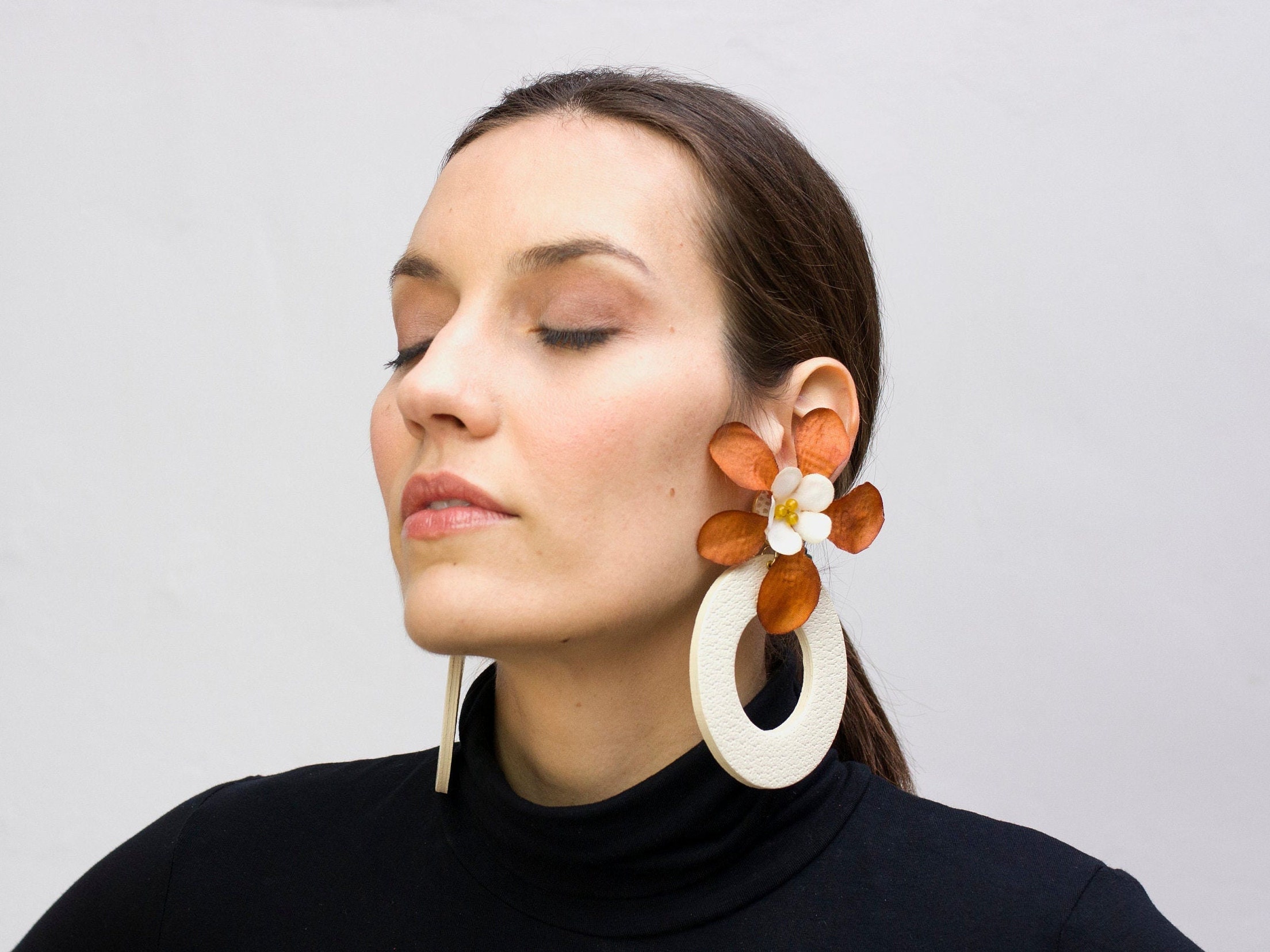 Large statement hoops and flower earrings