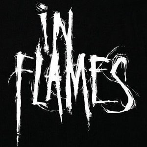 May include: Black and white logo for the band In Flames. The logo is stylized with a gothic font and a distressed look.