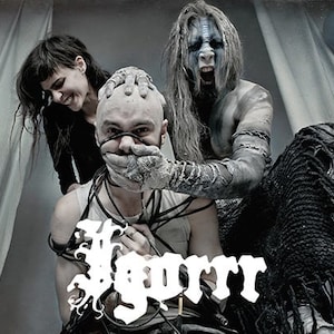 May include: A black and white photo of a band, with a person in the center wearing a white shirt and tied up with cords. The person on the left is wearing a black shirt and the person on the right is wearing a white and black outfit. The band's name "Yyrra" is written in white letters in the bottom center of the image.