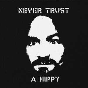 May include: Black and white image of a man's face with the text "NEVER TRUST A HIPPY" above the face.