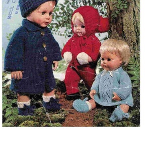 May include: Three knitted doll outfits, a blue coat with a matching hat, a red hooded jumpsuit, and a blue dress with a matching hat. The dolls are posed in a woodland setting.