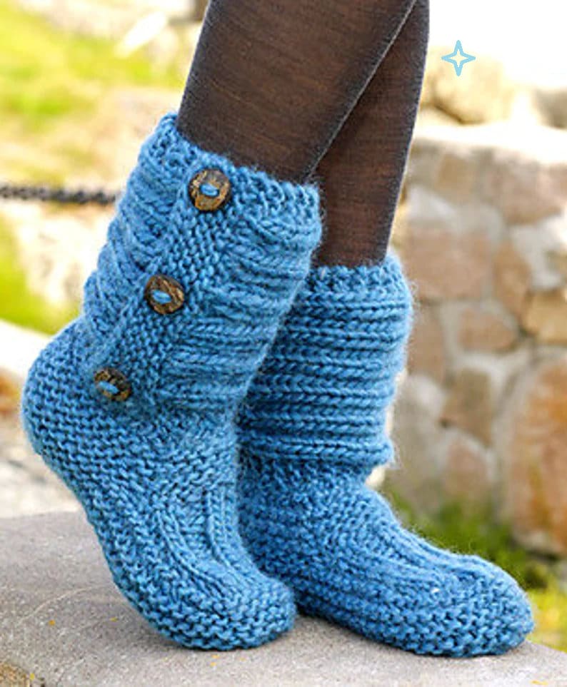 May include: A pair of blue knitted slipper boots with wooden button accents.